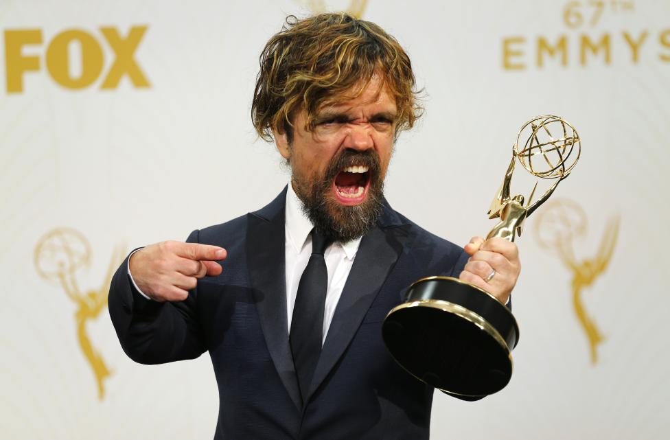 Actor Peter Dinklage poses backstage with his award for Outstanding Supporting Actor in a Drama Series for his role in HBO's "Game of Thrones". REUTERS/Mike Blake