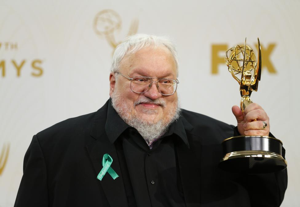 George R. R. Martin holds the award for Outstanding Drama Series for HBO's "Game Of Thrones". REUTERS/Mike Blake