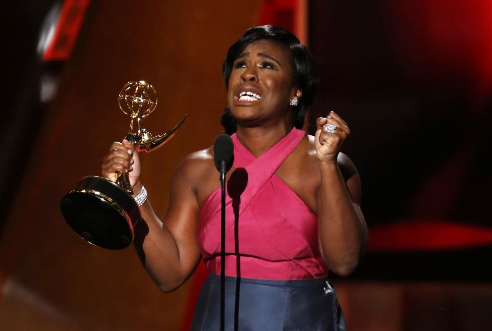 Uzo Aduba accepts the award for Outstanding Supporting Actress In A Drama Series for her role in Netflix's "Orange is the New Black". REUTERS/Lucy Nicholson